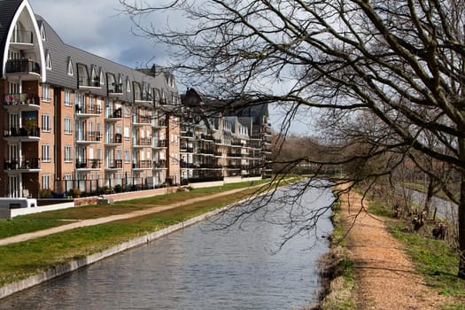 Nice Apartments in an apartment block with water view. There's a woodchips footpath along the water. This residential district is located in Voorschoten in the Netherlands.