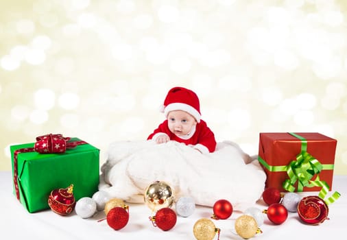 5 months old baby dressed as Santa for Christmas.