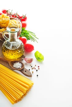 Raw Pasta with ingredients on white background.