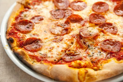 Delicious fresh pepperoni pizza on plate. Selective focus