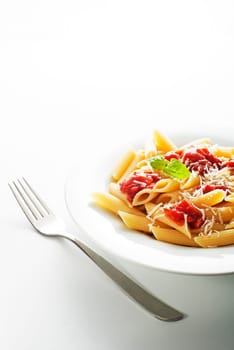 Plate of penne pasta with tomato sauce and parmesan cheese.