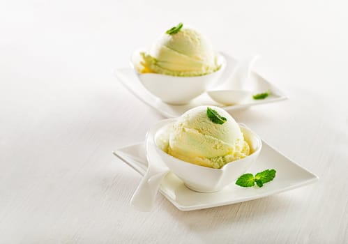 Fresh fruit sorbet ice cream in a white bowl.