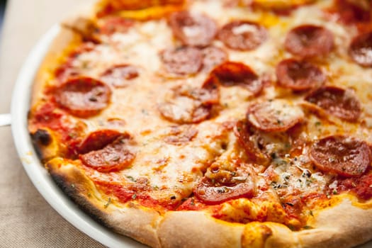 Delicious fresh pepperoni pizza on plate. Selective focus