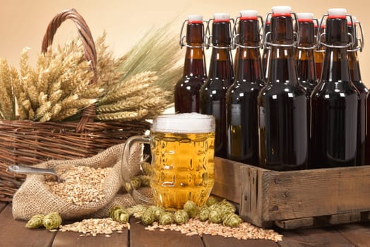 Beer crate and beer glass with wheat,barley,hops and malt