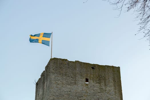 Swedish Flag on Visby Town Wall in Gotland, Sweden.