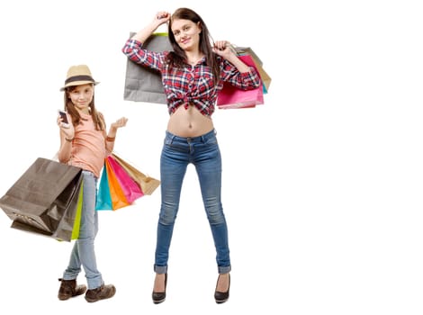 a beautiful girl and her little sister go shopping during sales
