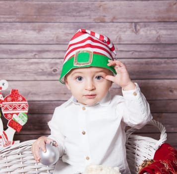 Portrait of 1 year old baby boy, Christmas theme, studio shot.