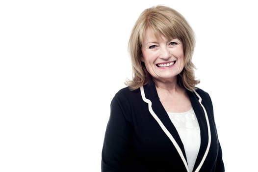Smiling senior woman in front of white background