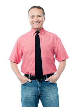 Senior male entrepreneur posing with hands in pockets