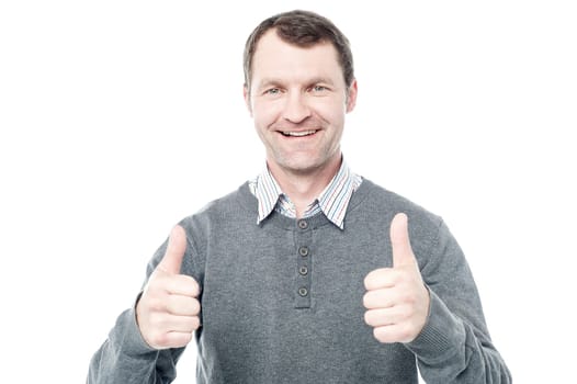 Happy middle aged man showing double thumbs up