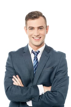 Business professional posing with arms folded over white