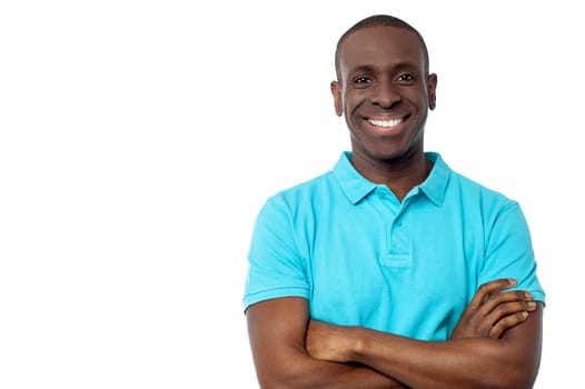 Smiling middle aged man with folded arms