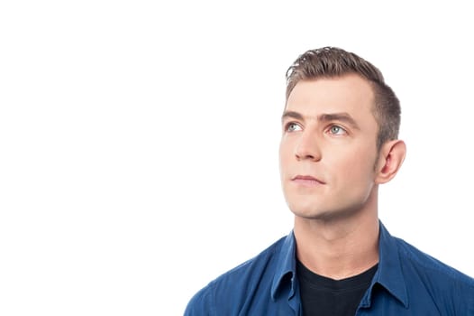 Young man looking away at something casually