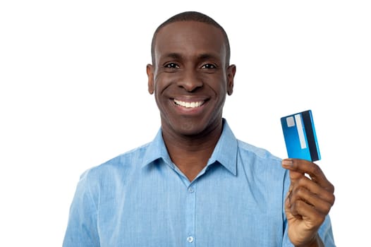 Handsome man displaying his cash card towards camera