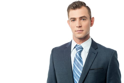 Handsome young businessman posing to the camera