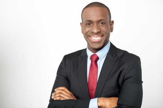 Handsome african manager with folded arms