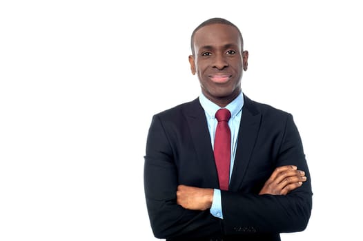 Happy business executive with arms folded