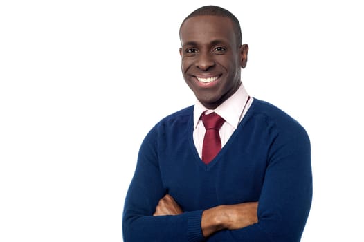 Young professional posing to camera with arms crossed