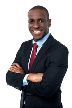 Confident business man with crossed arms over white