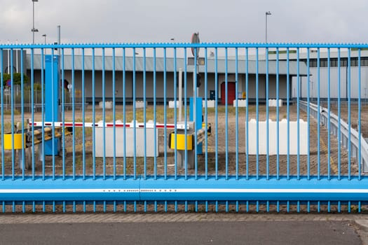 Closed gate barricaded with concrete blocks in the Port of Rotterdam in the Netherlands