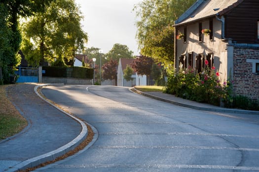 Asphalted winding village street somewhere in France