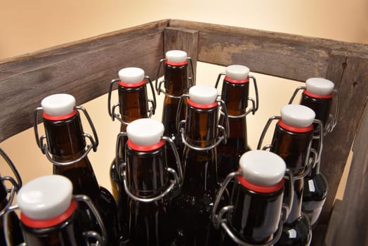Close-up of many beer bottles with ironing closure in old beer box