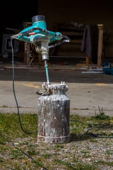 With a drill with Quirl you can even stir mortar in a milk jug