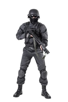 Spec ops police officer SWAT in black uniform with shotgun studio shot