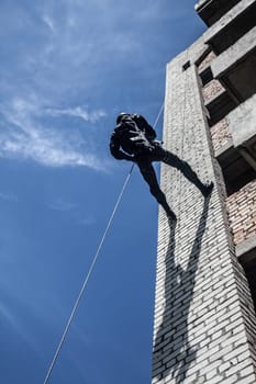 Spec ops police officer SWAT during assault operation