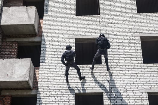 Spec ops police officer SWAT during assault operation