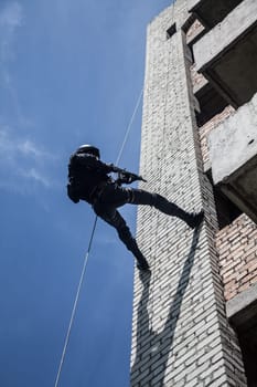 Spec ops police officer SWAT during assault operation