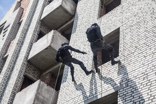 Spec ops police officer SWAT during assault operation