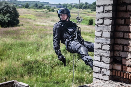 Spec ops police officer SWAT during assault operation