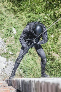 Spec ops police officer SWAT during assault operation