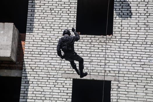 Spec ops police officer SWAT during assault operation