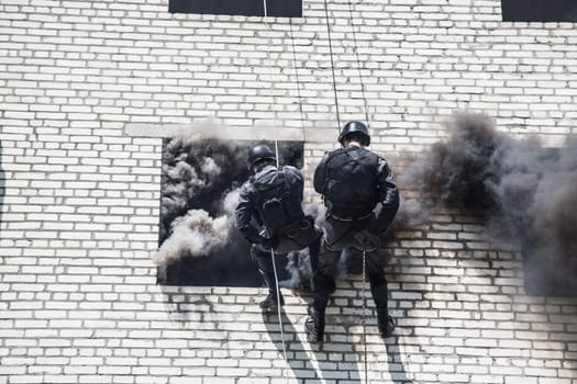 Spec ops police officer SWAT during assault operation