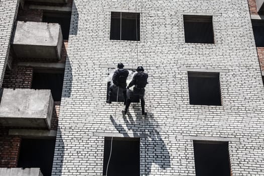 Spec ops police officer SWAT during assault operation