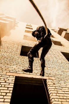 Spec ops police officer SWAT during assault operation
