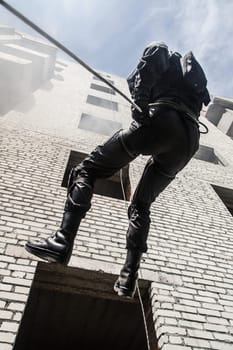 Spec ops police officer SWAT during assault operation