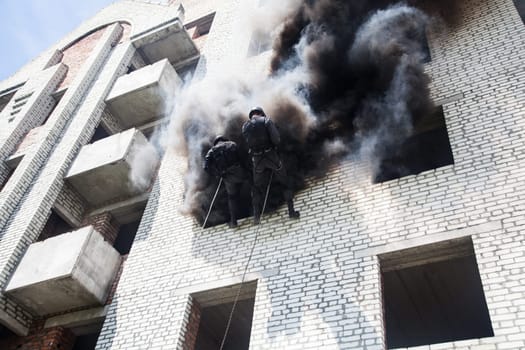 Spec ops police officer SWAT during assault operation