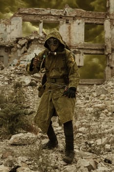 Post apocalypse. Sole survivor in tatters and gas mask on the ruins of the destroyed city