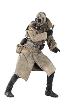 Nuclear post apocalypse. Studio shot of survivor in tatters and gas mask