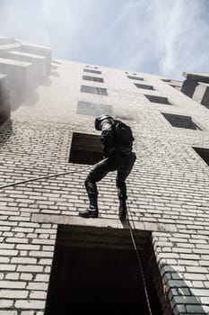 Spec ops police officer SWAT during assault operation