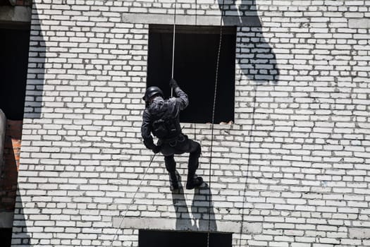 Spec ops police officer SWAT during assault operation