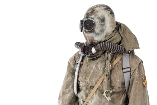 Nuclear post apocalypse. Studio shot of survivor in tatters and gas mask