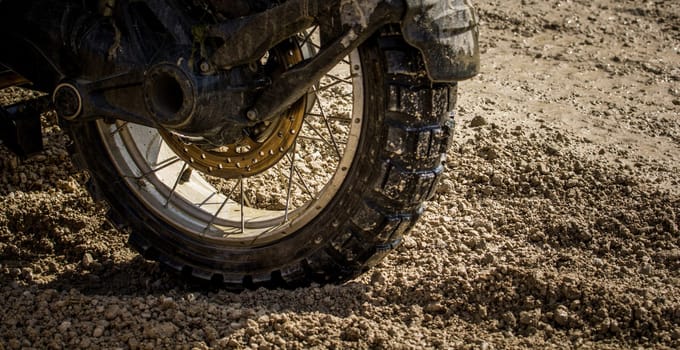 Close-up of a dirty motocross tyre - a motorsport for adrenaline junkies