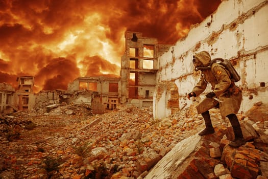 Post apocalypse. Sole survivor in tatters and gas mask on the ruins of the destroyed city