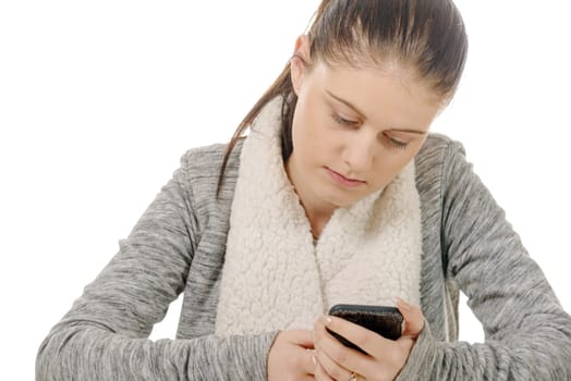 a beautiful hispanic girl texting on her cellphone