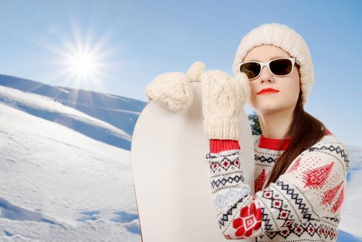 a portrait of a happy young girl snowboarding with sunglasses