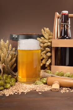 Beer carriers,beer barrels and beer glasses with wheat,barley,hops and malt